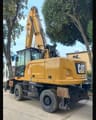 2018 Caterpillar MH3022 material handler, rear three-quarter view