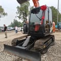 2023 Hitachi ZX70 mini excavator, front three-quarter view