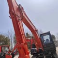 Hitachi ZX120 crawler excavator, low-angle boom view