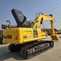 2024 Komatsu PC210 crawler excavator, rear three-quarter view