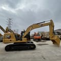 2023 Caterpillar 320GC crawler excavator, side profile view