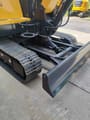 2026 LiuGong 906FG4 Mini Excavator, close-up of the black rubber tracks and the front dozer blade in a lowered position.