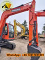 2024 Doosan DX80 mini excavator, close-up view of boom and bucket