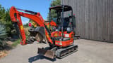 2022 Kubota U17-3 Mini Excavator with a front dozer blade in the lowered position