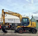 1998 Komatsu PW130ES wheel excavator side view