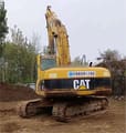 2018 Caterpillar 320C crawler excavator, rear three-quarter view