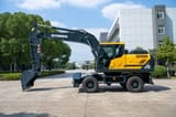 2026 Hyundai HW210 Wheel Excavator showing the full side profile of the dark gray body and yellow engine compartment