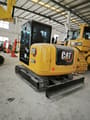 Caterpillar 307E2 mini excavator, rear three-quarter view
