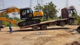 2026 Sany SY210 C-9 crawler excavator side view on a flatbed trailer