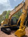 2024 Caterpillar 312 GC crawler excavator, rear three-quarter view