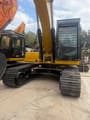 2024 Caterpillar 323 crawler excavator, rear-quarter view