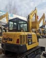 2025 Komatsu PC58 mini excavator rear three-quarter view