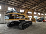 Caterpillar 345BL crawler excavator, rear three-quarter view