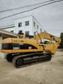 Caterpillar 320CL crawler excavator, rear three-quarter view