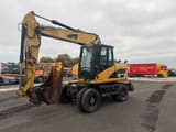 2008 Caterpillar M313D wheel excavator, side view