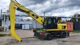 2011 Caterpillar M318D MH material handler, side view