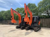 2022 Doosan DX60LC-9 crawler excavator, front three-quarter view