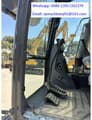 2026 XCMG XE135GA Crawler Excavator with a detailed view of the cab interior and foot pedals.