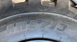 2024 Apollo 10.00-20 Wheel Excavator tire, displaying the 'AWE 713' model marking on the sidewall.