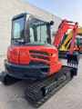 2022 Kubota U55-4 mini excavator, rear three-quarter view