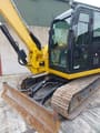 2015 Caterpillar 308 excavator, front three-quarter view