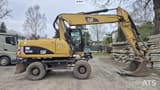 2010 Caterpillar M318D wheel excavator, side view