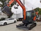 2022 Doosan DX55 mini excavator, front three-quarter view
