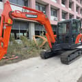 Doosan DX60-9C mini excavator, side view