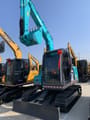2024 Kobelco SK75 crawler excavator, front three-quarter view