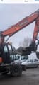 2019 Doosan DX140W-5 wheel excavator, side view of boom and cab