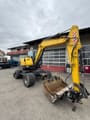 2020 Doosan DX57W-5 wheel excavator, front three-quarter view