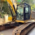 2022 Caterpillar 333 crawler excavator, side view of cab and tracks