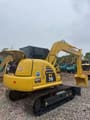 2023 Komatsu PC70-8 mini excavator, rear three-quarter view