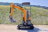 2025 APS KME10 Mini Excavator showing the black rubber tracks and undercarriage from a side perspective.