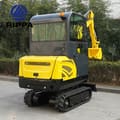 2026 Rippa R330 Mini Excavator from a rear three-quarter view, showcasing the yellow engine compartment and the black cab.
