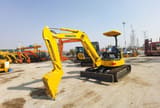 2022 Komatsu mini excavator, rear three-quarter view