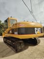 Caterpillar 320CL crawler excavator, rear three-quarter view
