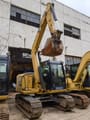 2024 Caterpillar 307E excavator, front three-quarter view