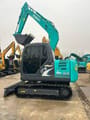 Kobelco SK75 mini excavator, side view
