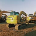2024 Komatsu PC70-8 mini excavator, rear three-quarter view