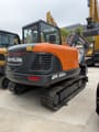 2026 Develon DX60D-10 crawler excavator, rear three-quarter view