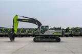 2025 Zoomlion ZE385G Crawler Excavator with its green boom and arm extended forward, showing the digging bucket.