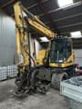 2018 Komatsu PW148-11 wheel excavator, front three-quarter view