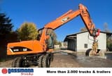 2011 Caterpillar M318D wheel excavator, rear three-quarter view