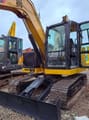 2025 Caterpillar 307 crawler excavator, front three-quarter view