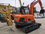 2022 Doosan DX55-9C mini excavator, rear three-quarter view