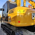 2023 Caterpillar 312D GC crawler excavator, rear three-quarter view