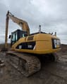 2007 Caterpillar 325DL crawler excavator, rear three-quarter view