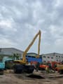 2023 Caterpillar 320BL amphibious excavator, rear three-quarter view