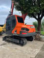 Doosan DX75-9C mini excavator, rear three-quarter view